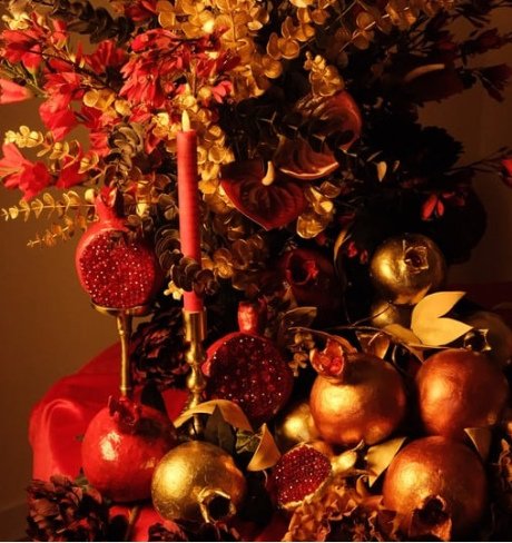 Pomegranate and candle floral installation